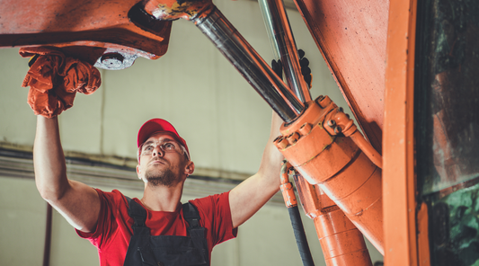 worker and heavy machinery