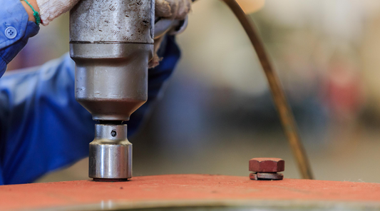 pneumatic torque wrench tightening a bolt