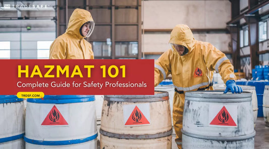 workers inspecting barrels with flammable placards