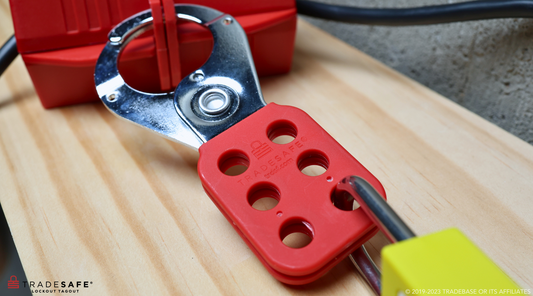 steel lockout hasp attached to a plug lock