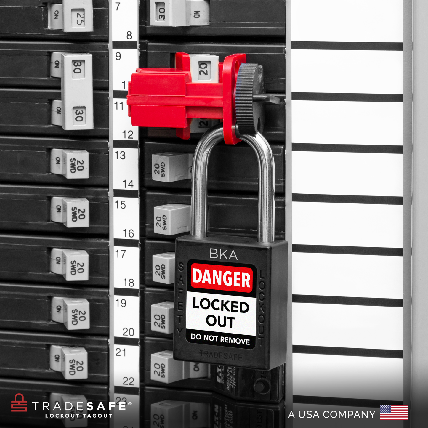 a black loto padlock in use along with a universal multipole circuit breaker lock