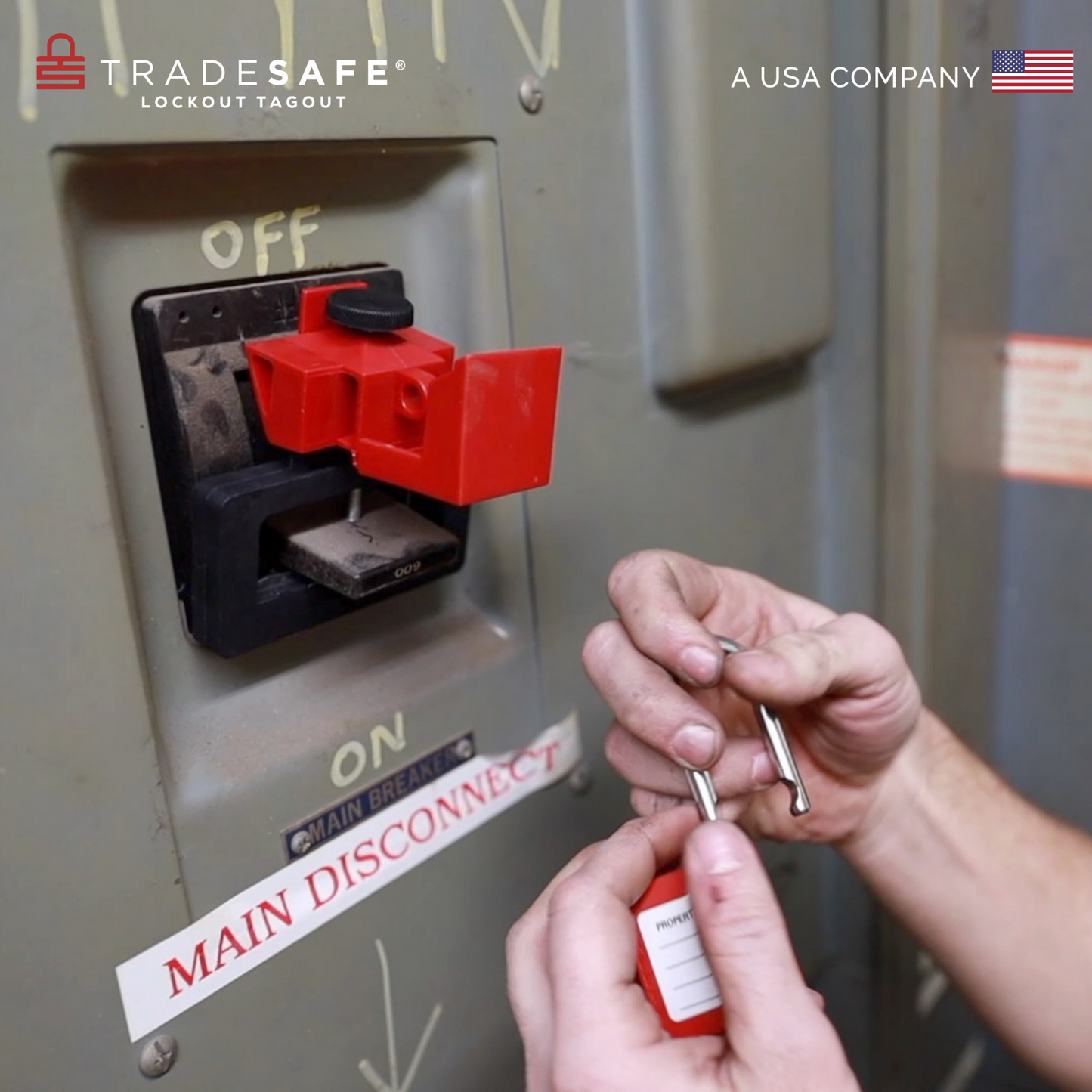 an over-sized red circuit breaker lock clamped on a circuit breaker switch ready to be locked out by a loto padlock