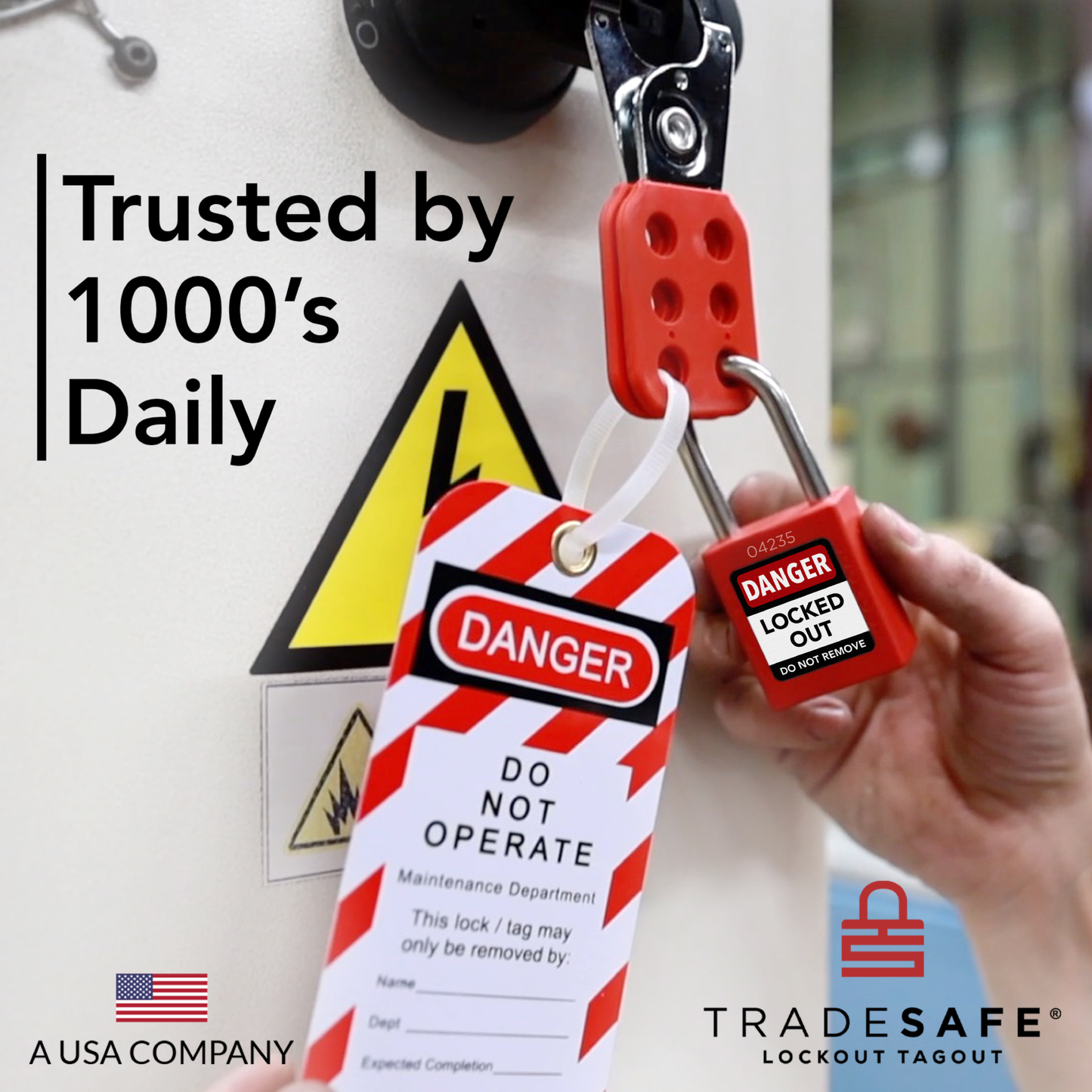 a red loto padlock in-use along with a loto tag and loto hasp in a machine with electrical hazard