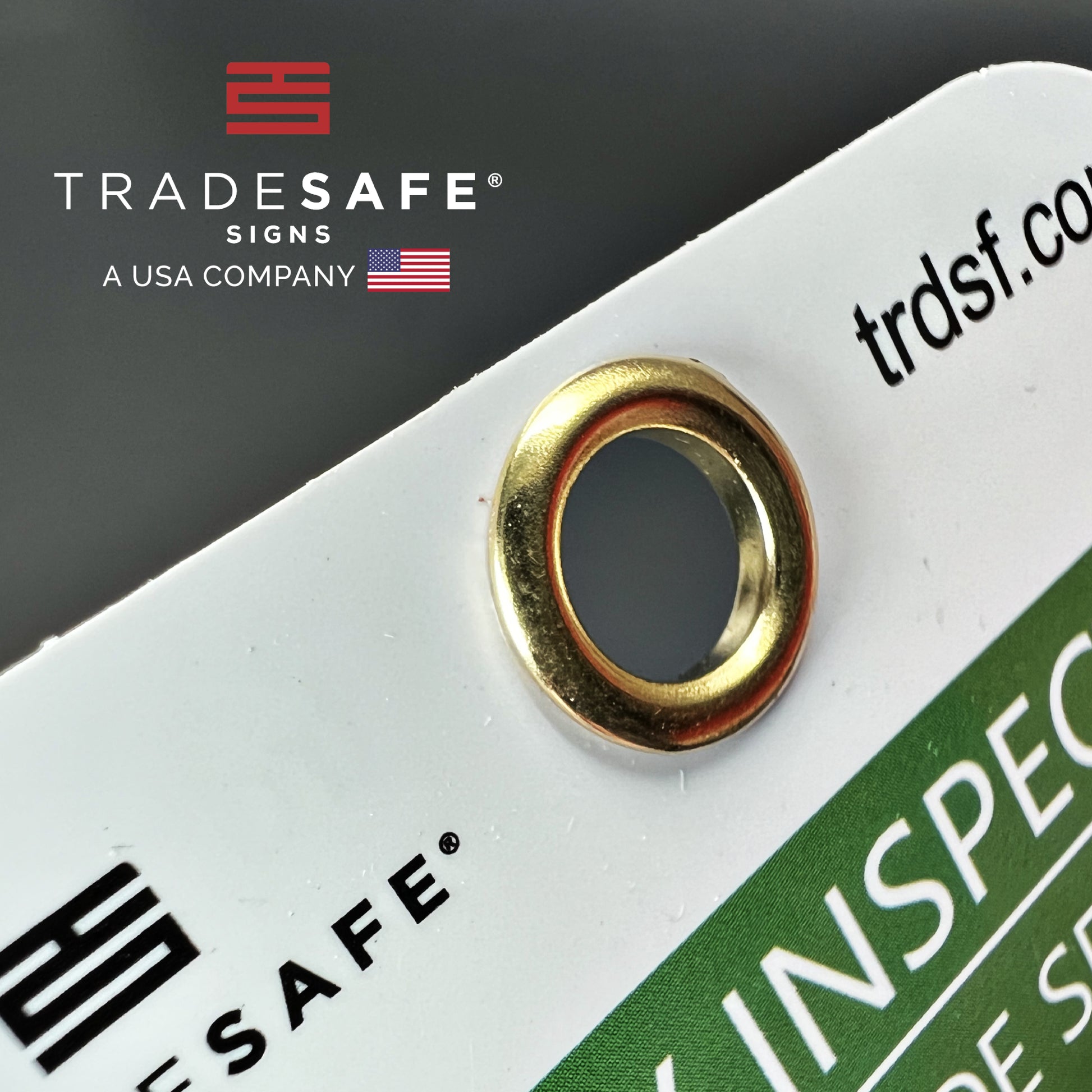 close-up view of bilingual tag focusing on its hole