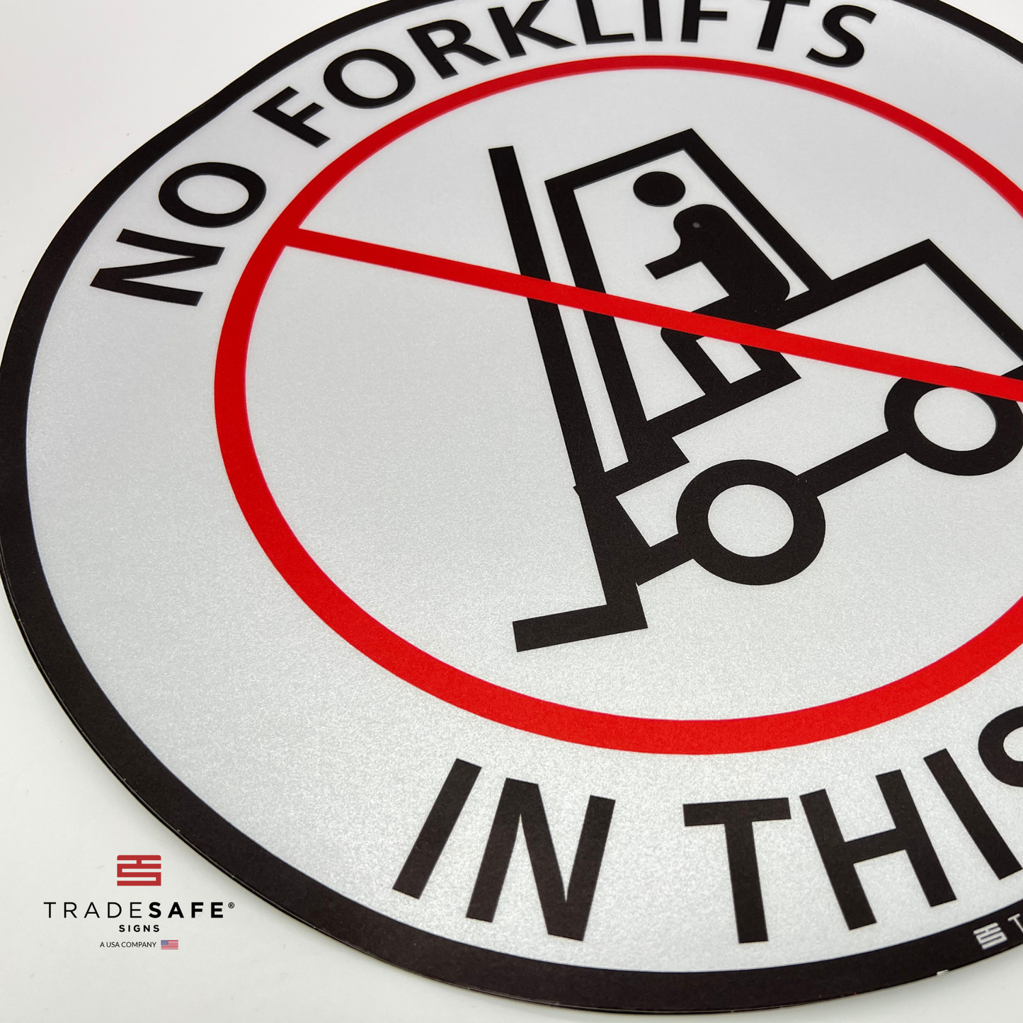 close-up of no forklifts in this area sign