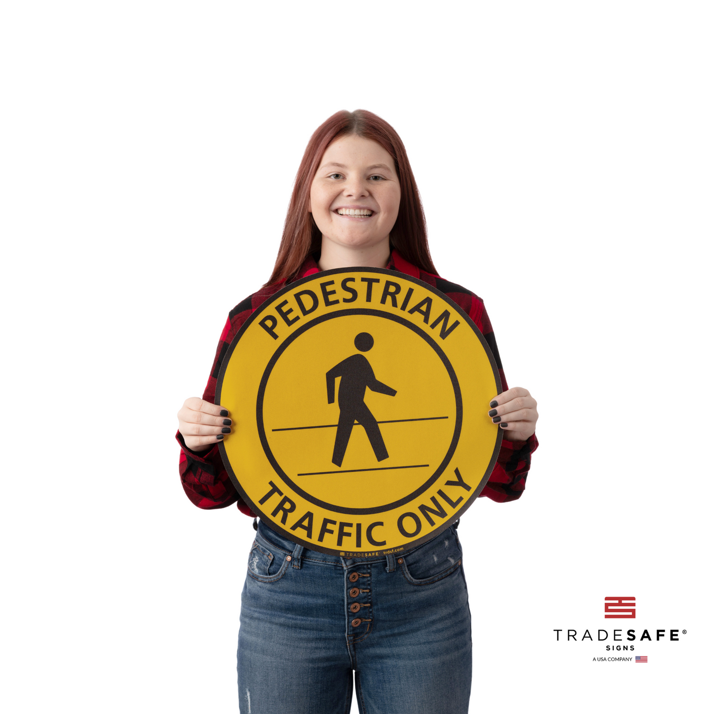 a person holding the pedestrian traffic only sign