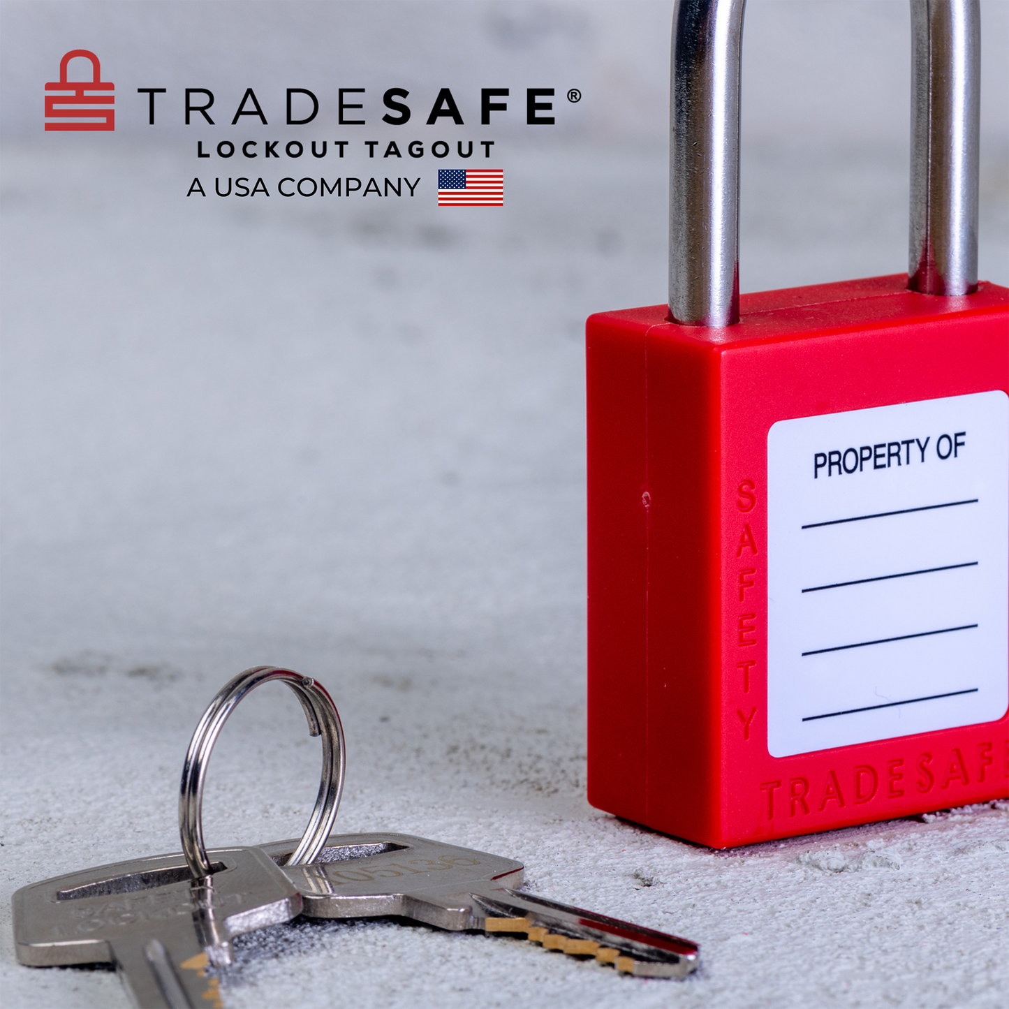 slanted back-view of a red loto padlock with 2 keys