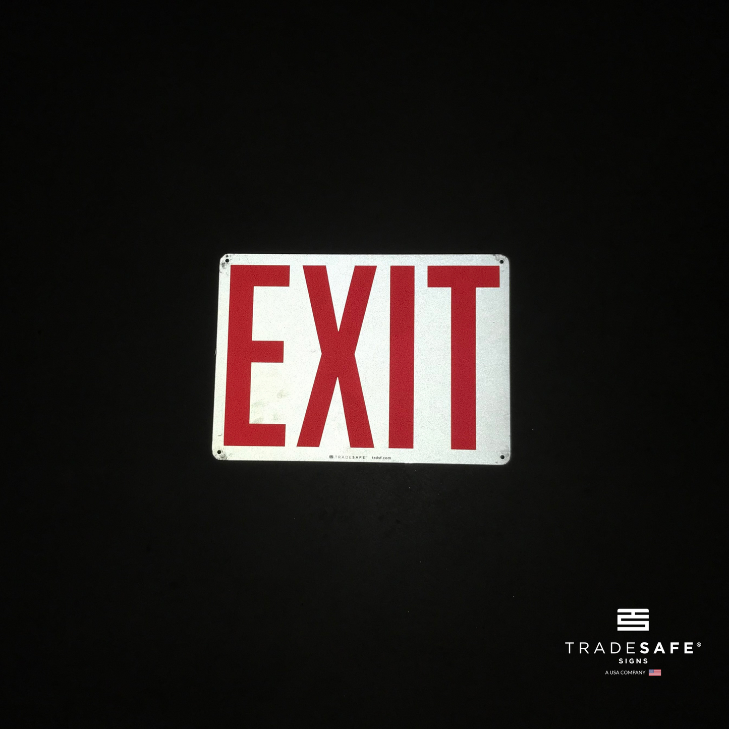 reflective attribute of exit sign on black background