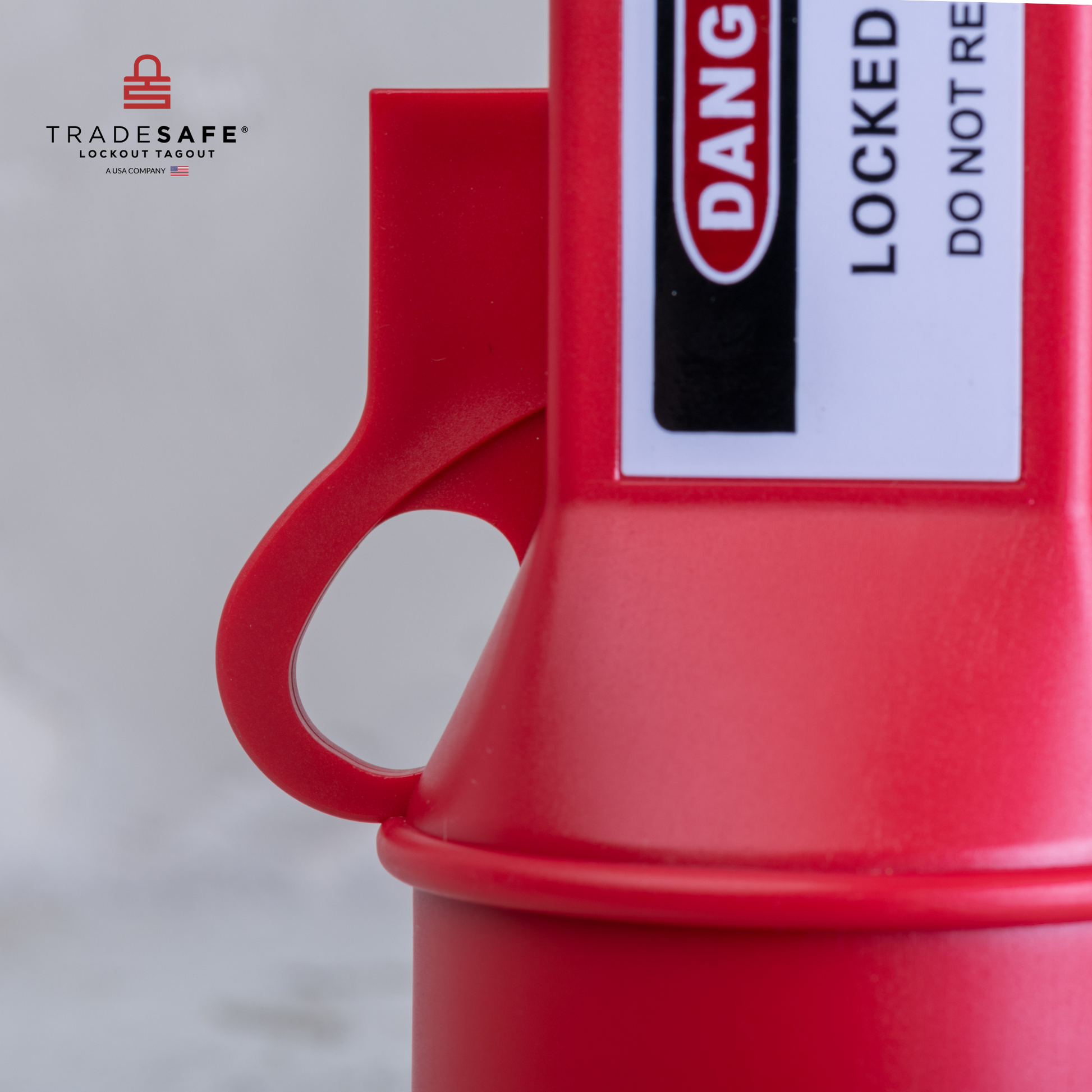 close-up view of the handle of a pin and sleeve socket lockout device