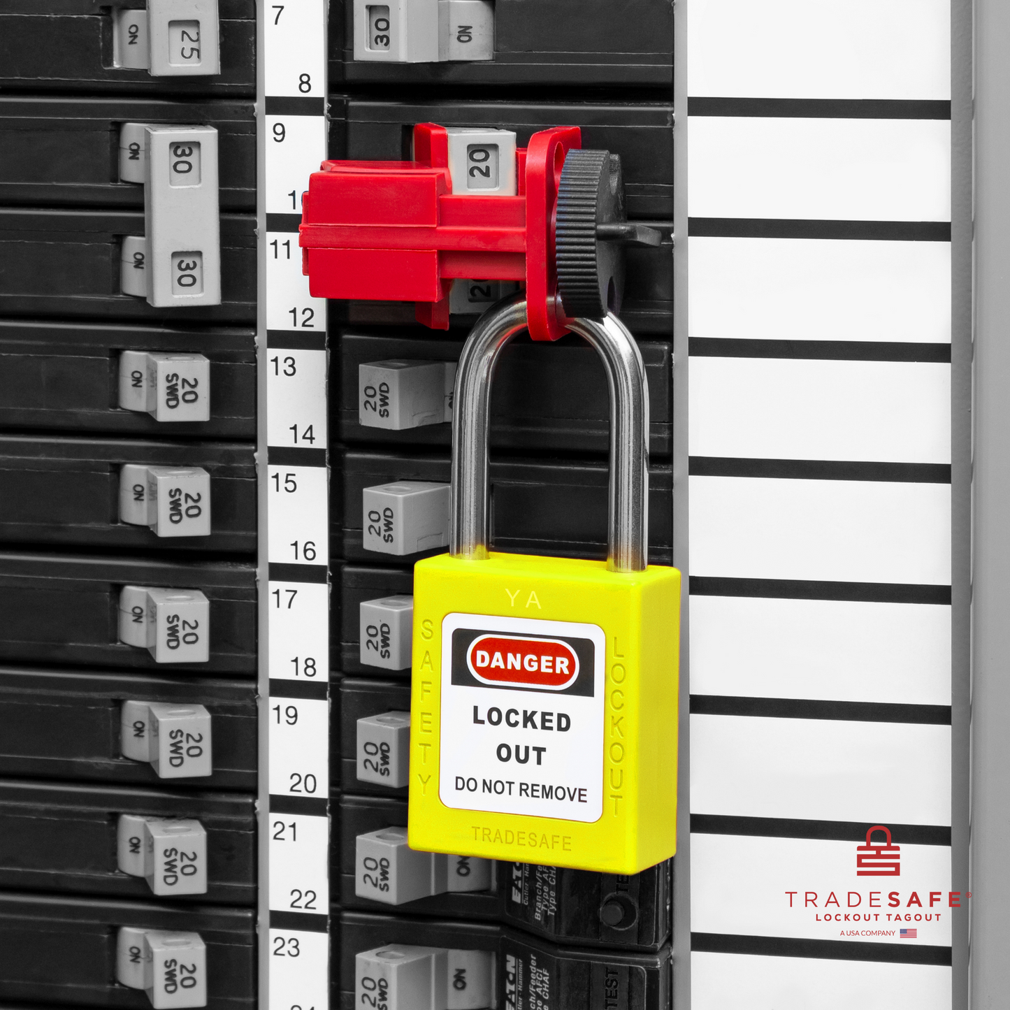 a yellow loto padlock in use along with a universal multipole circuit breaker lock