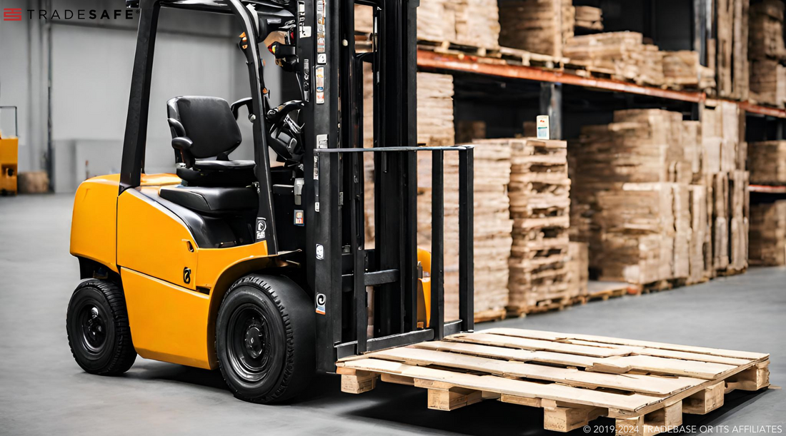 forklift lifting wood pallet in warehouse