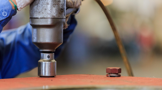 pneumatic torque wrench tightening a bolt 