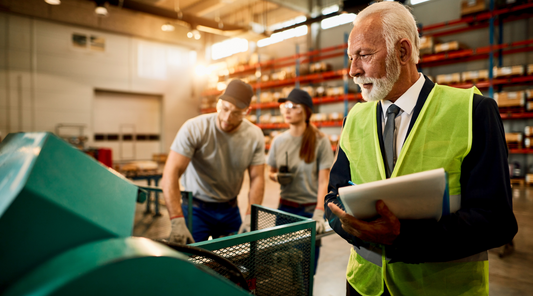 man with clipboard in industrial setting