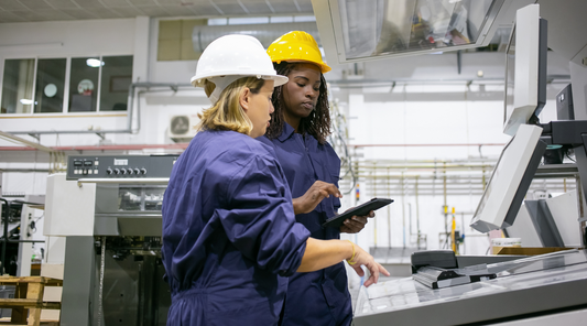 female workers looking at data on a screen