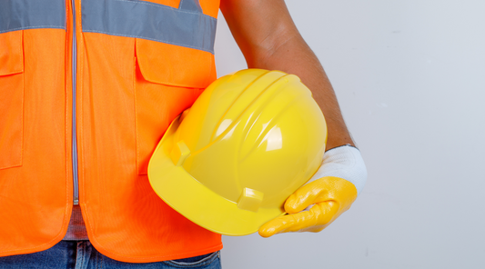 worker holding a hard hat