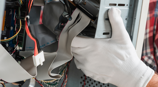 Worker carrying disassembled computer