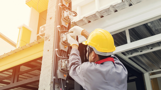 electrician working on utility pole