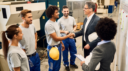 manager shaking hands with worker