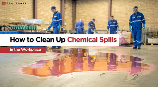 workers in PPE assessing a chemical spill