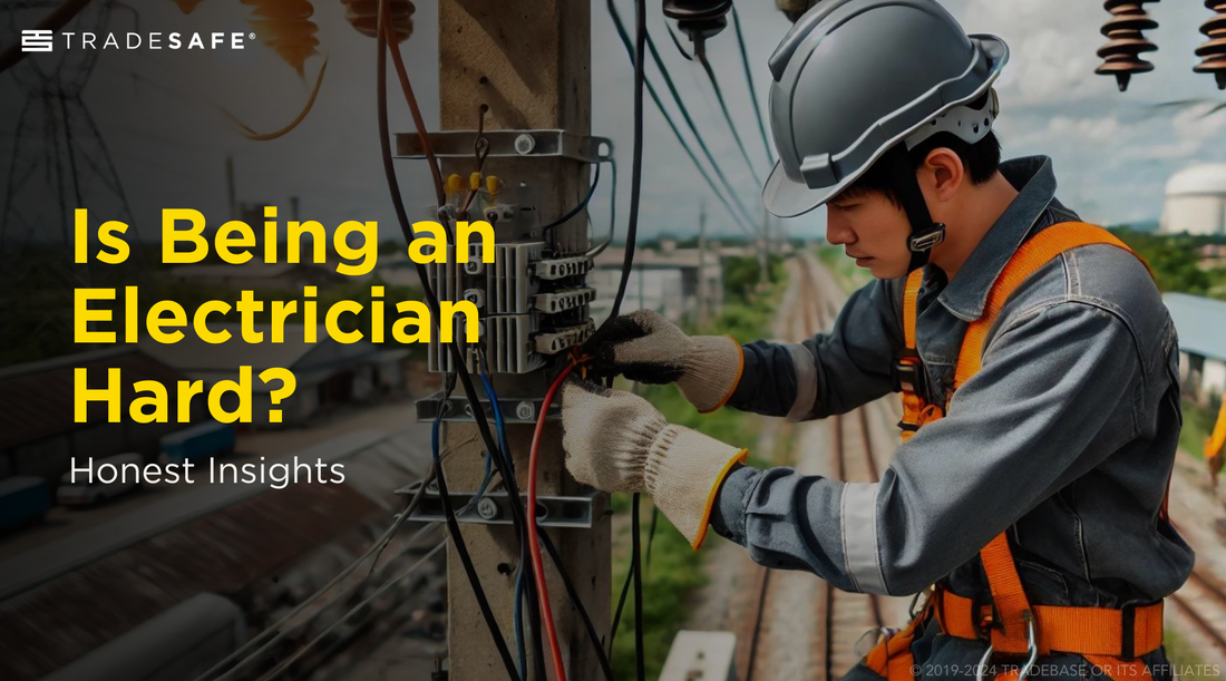 An electrician in full safety gear working on electrical cables