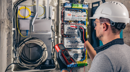 Electrician testing electrical wires