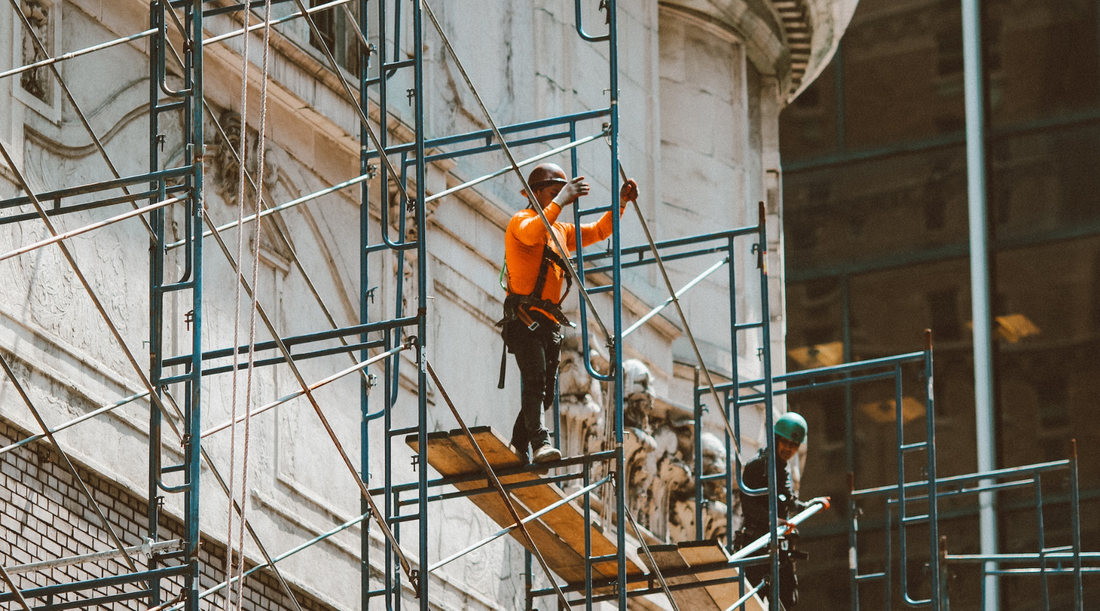 Worker in a scaffolding