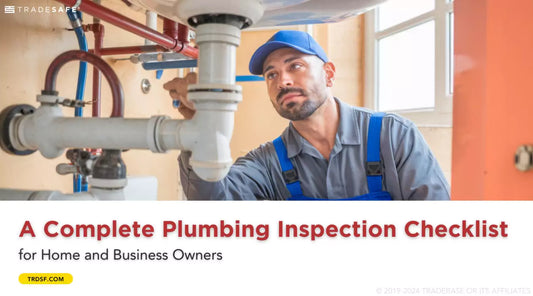 Plumber inspecting pipes under a sink