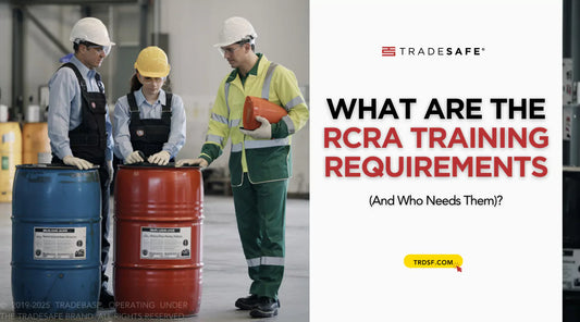 workers reviewing hazardous waste drums
