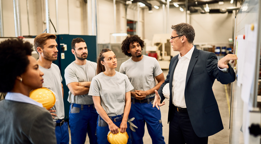 industrial workers listening to their supervisor