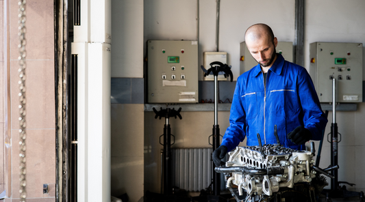 worker fixing machine parts