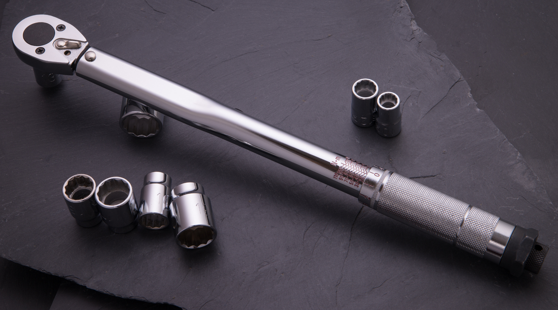silver torque wrench and sockets