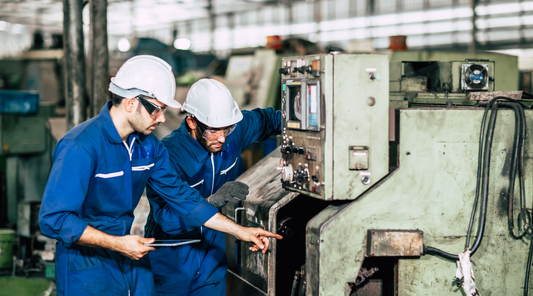 workers checking machinery