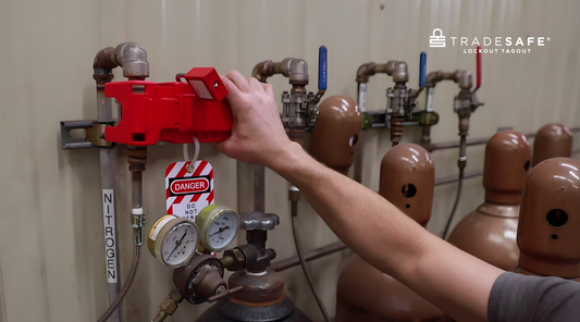 worker doing lockout tagout procedure