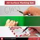 All-Surface Marking Set with a pen writing on glass, green surface, and warning label