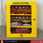 a closed yellow steel lockout station cabinet stocked with loto devices 