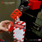 a loto kit in use with hasp, safety tag and padlock