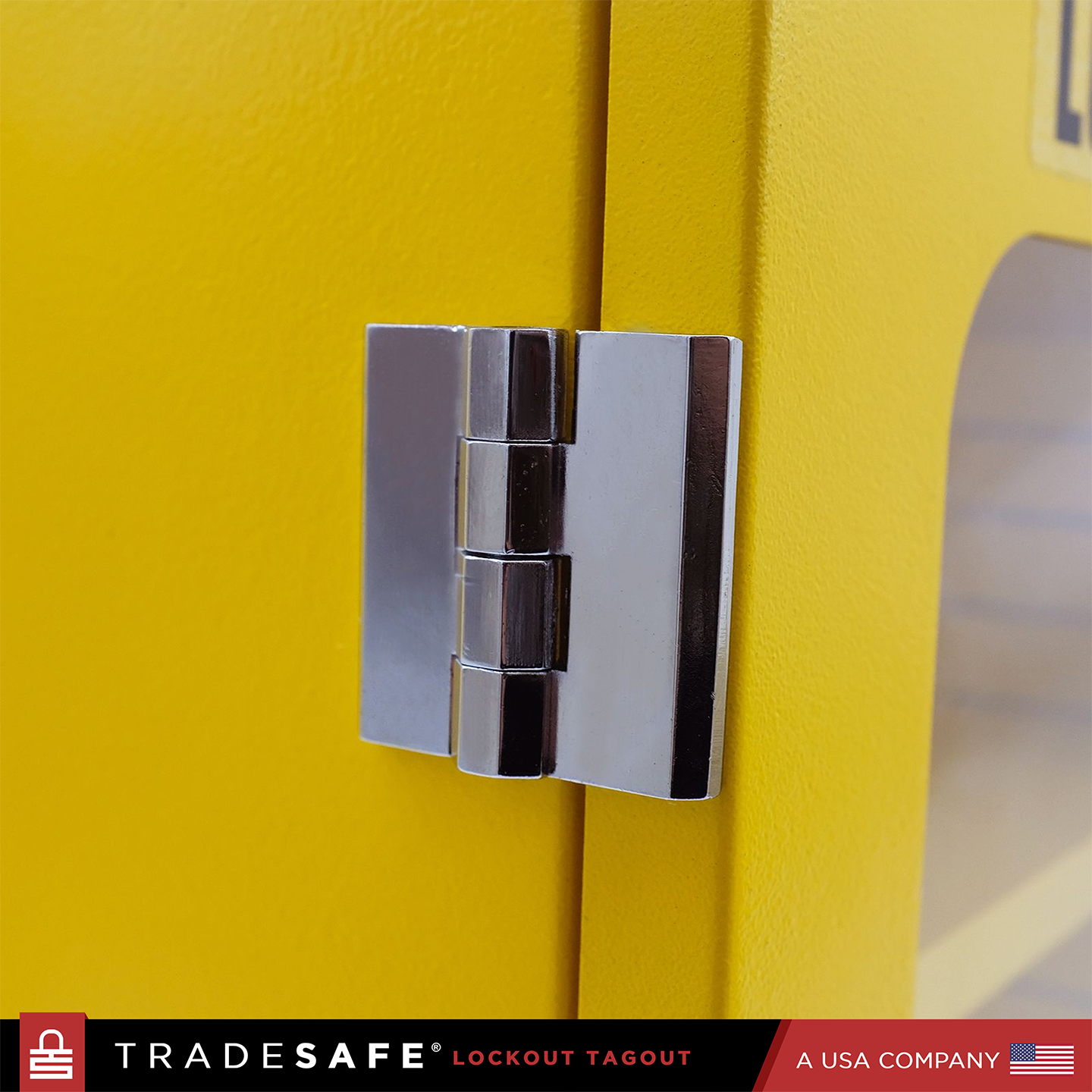 close-up view of the hinge on the outer side of yellow lockout station cabinet