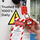 a loto tag in-use along with a loto lock and a steel hasp for a machine with electrical hazard