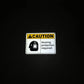 reflective attribute of hearing protection required sign in spanish