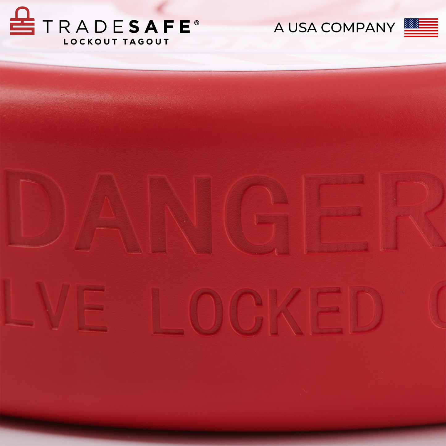 close up view of the warning label engraved on the side of a red gate valve lockout