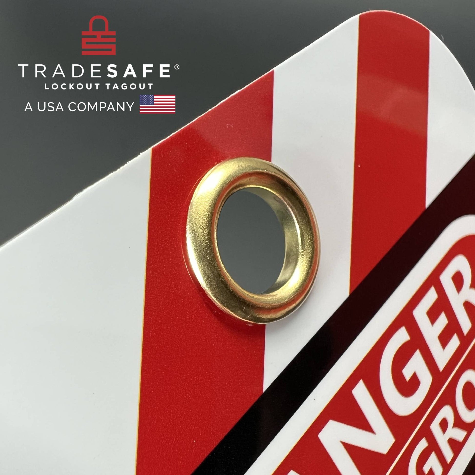 close-up view of bilingual danger tag focusing on its hole