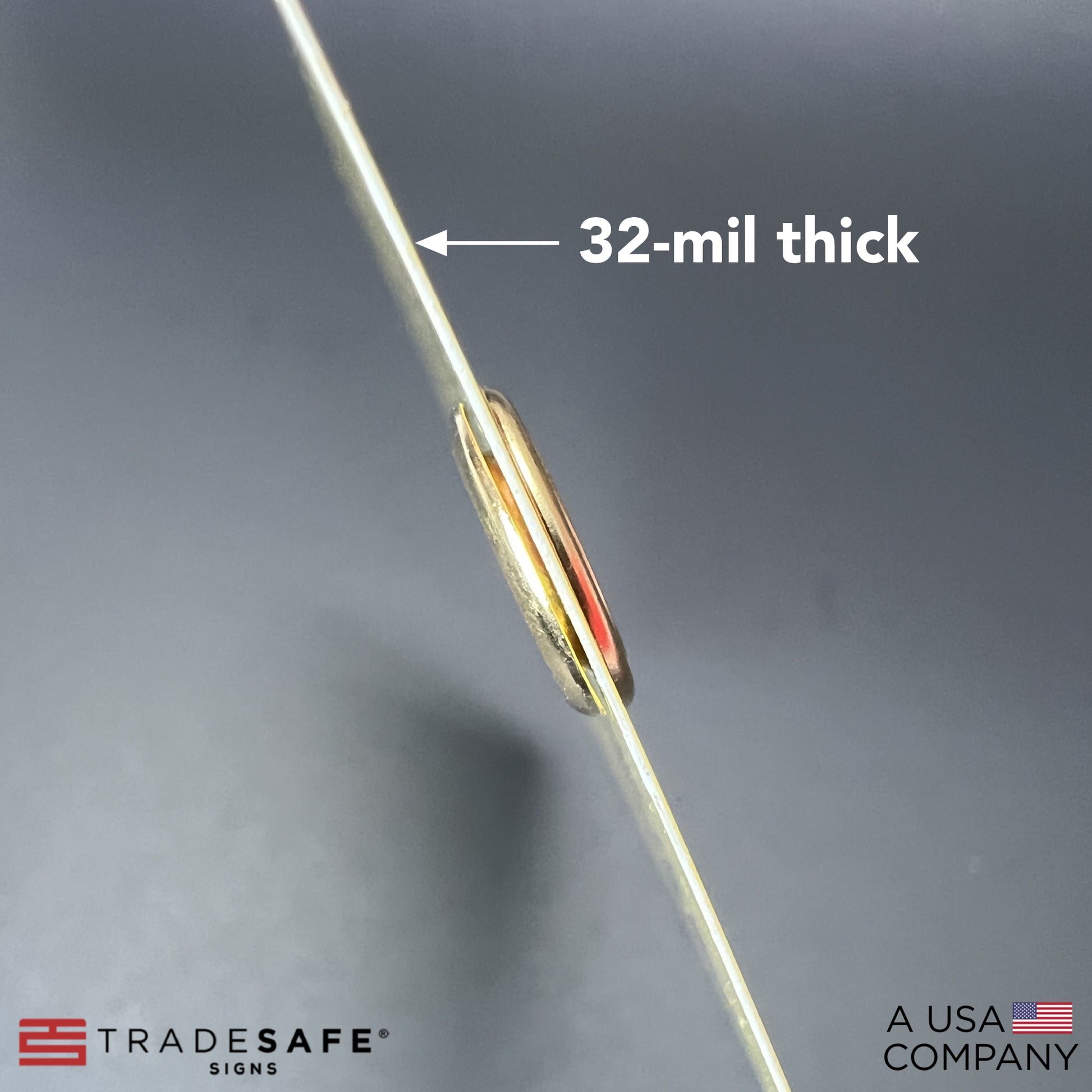 macro shot of caution out of service tag showing its thickness; 32-mil thick