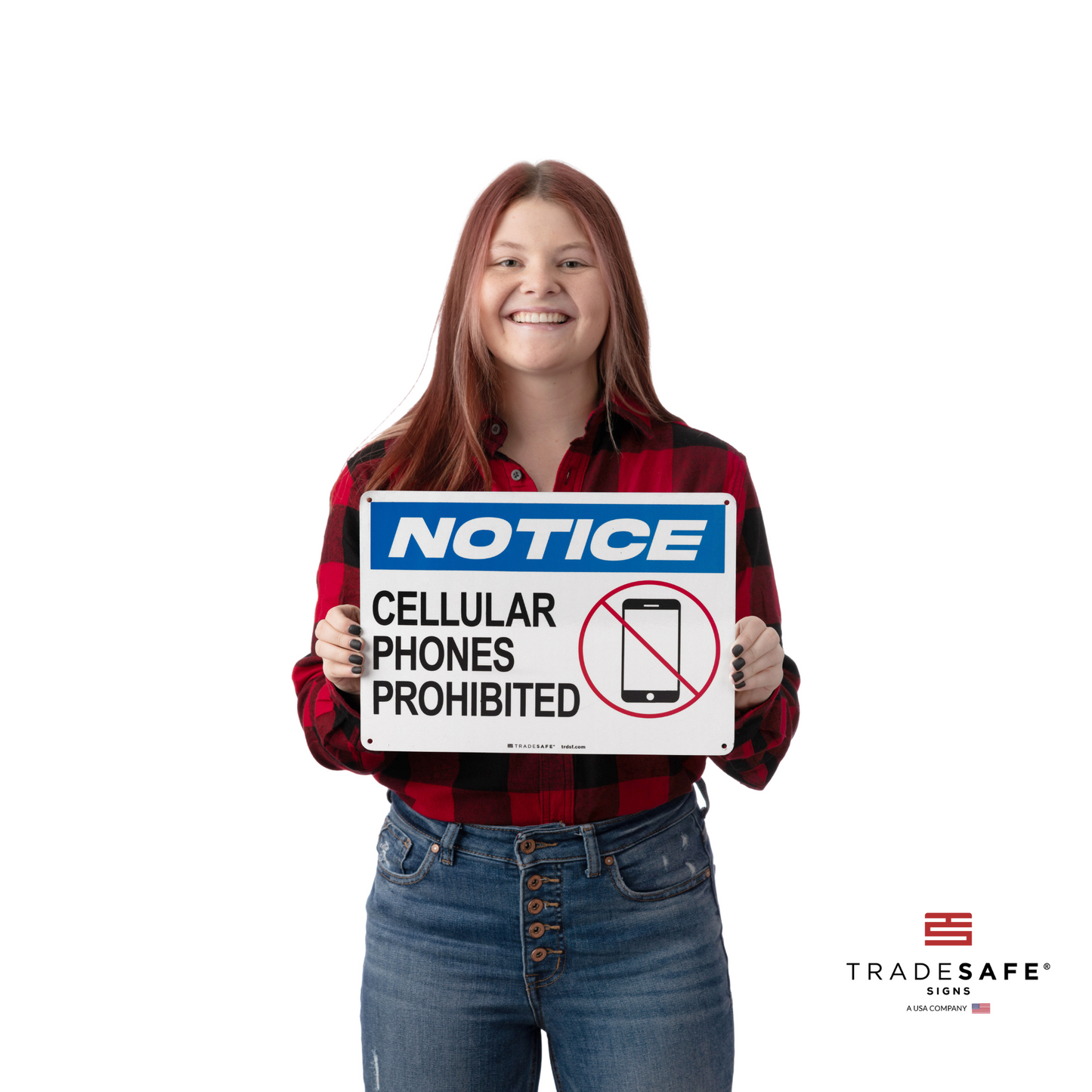 a person holding "notice cellular phones prohibited" sign
