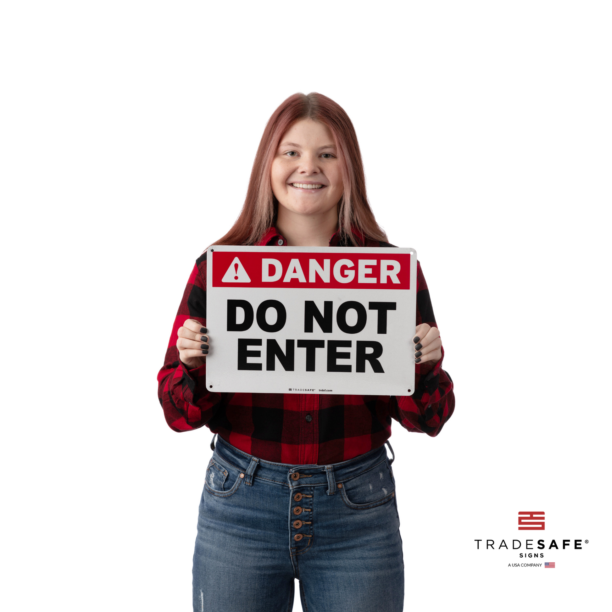 a person holding "danger do not enter" sign