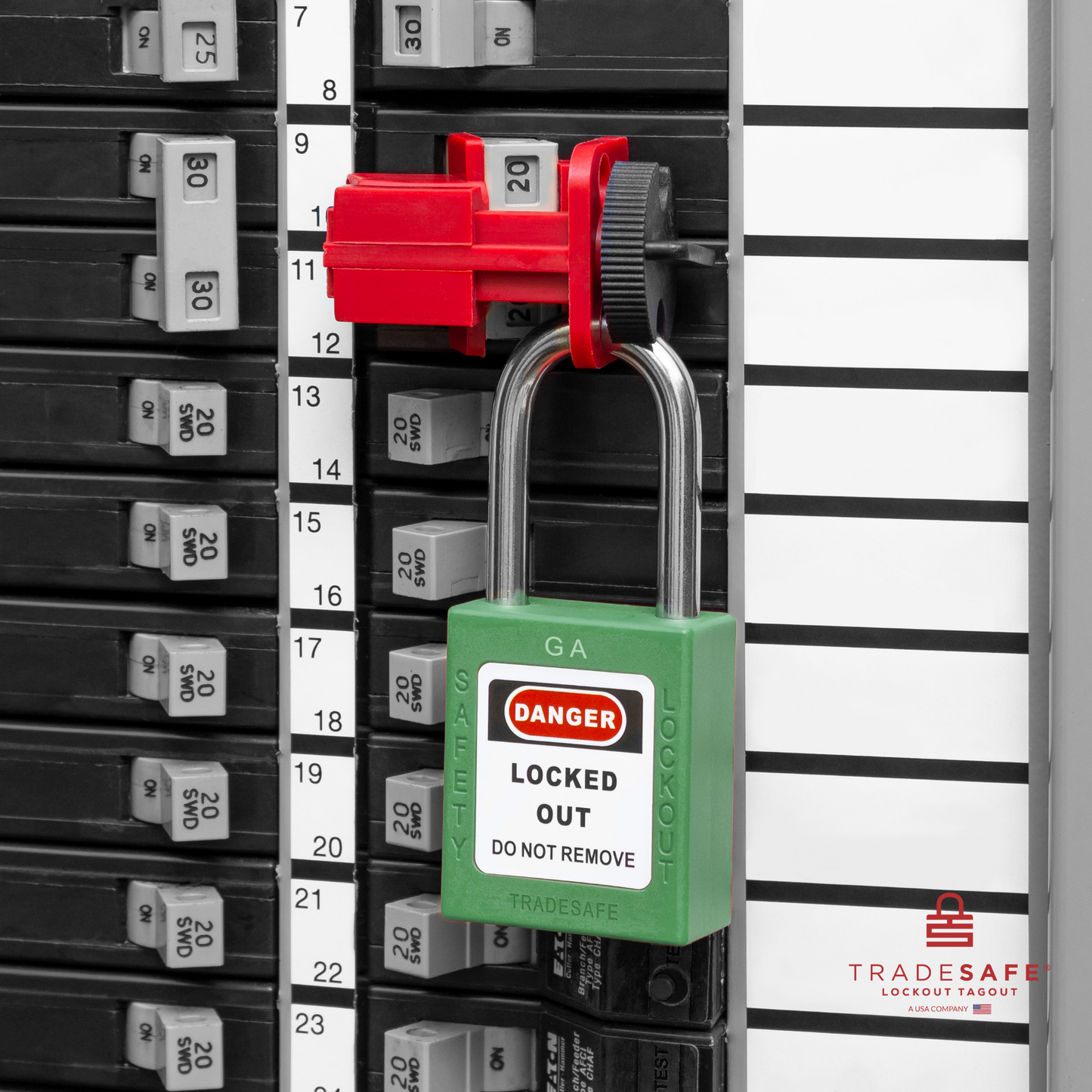 a green loto padlock in use along with a universal multipole circuit breaker lock