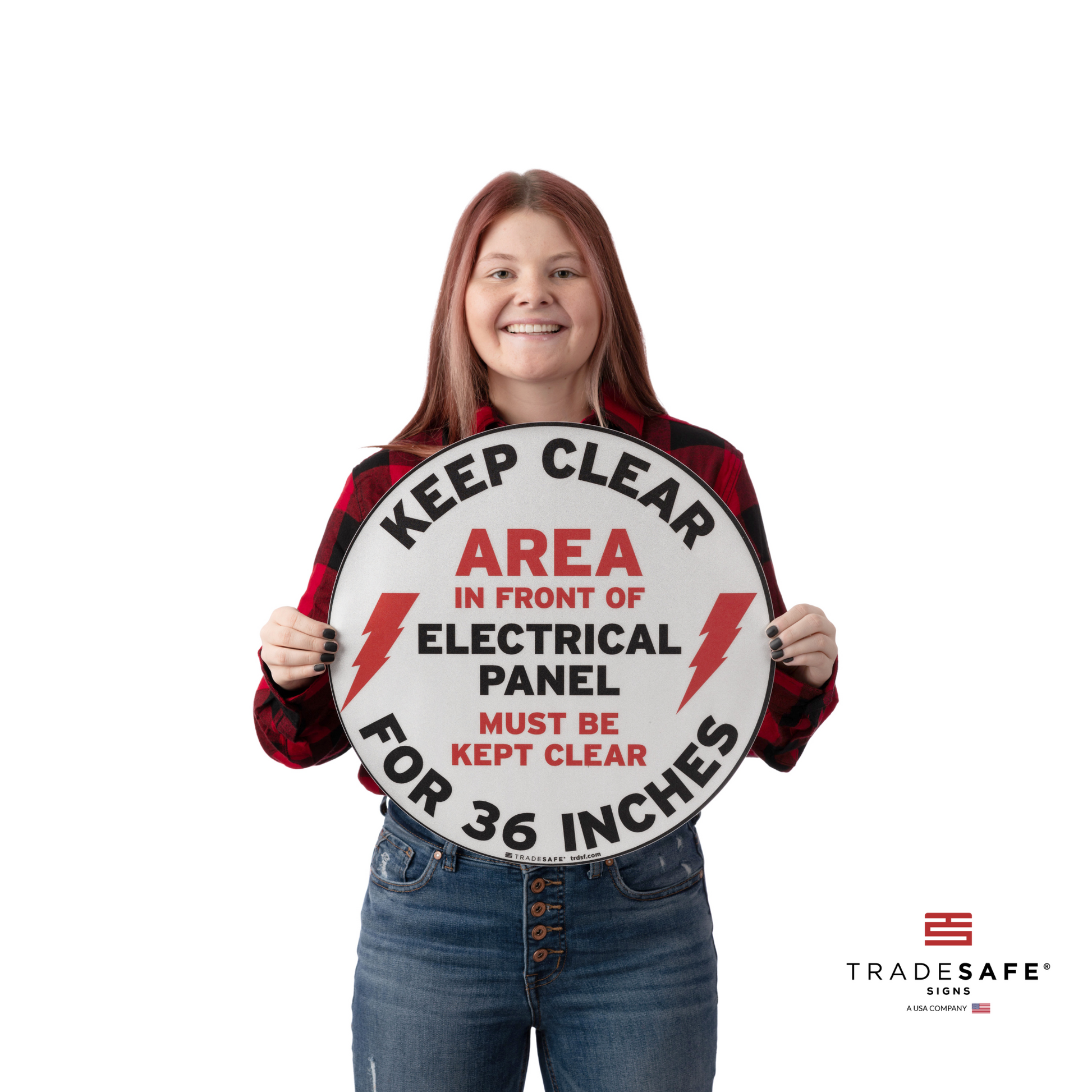 a person holding the keep clear electrical panel sign