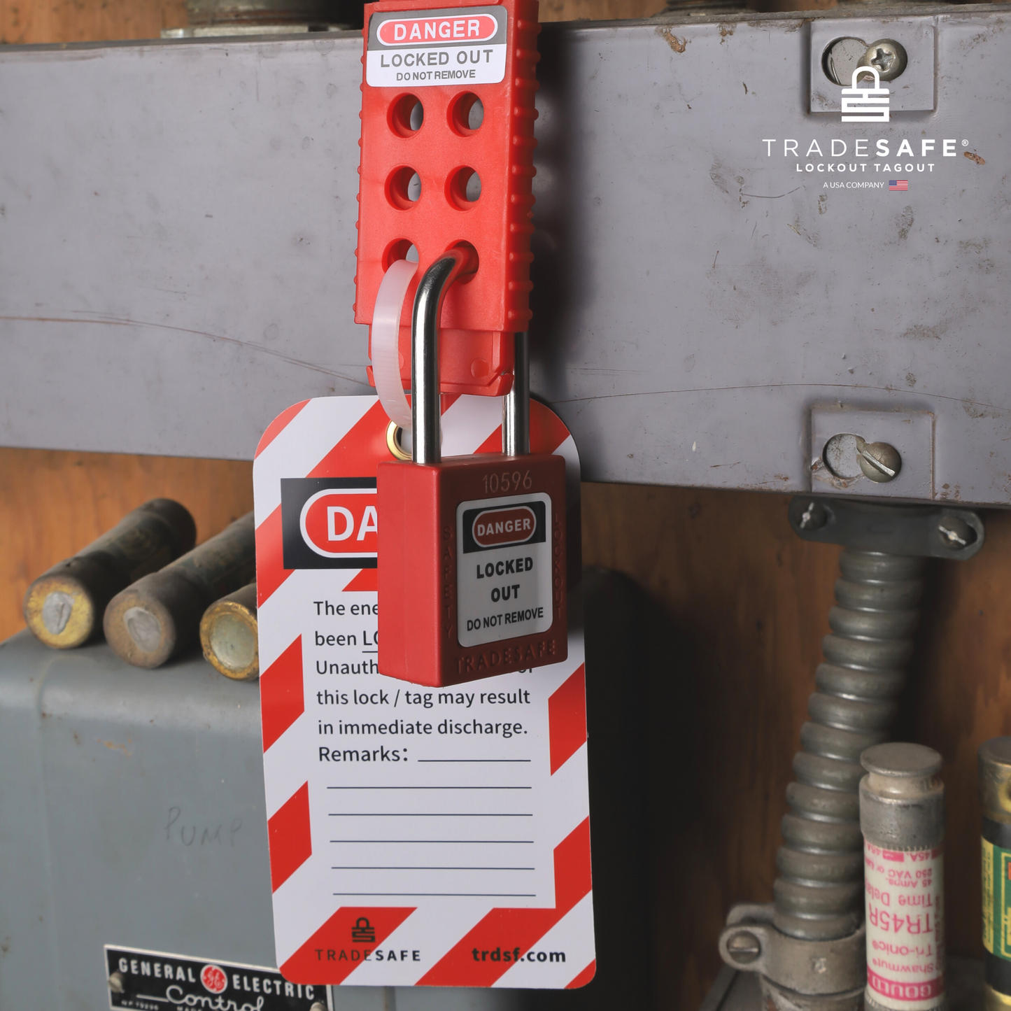 lockout tagout safety tag attached to a hasp and padlock locking out an equipment