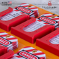 close-up view of an orange loto tags station ring down on a concrete floor
