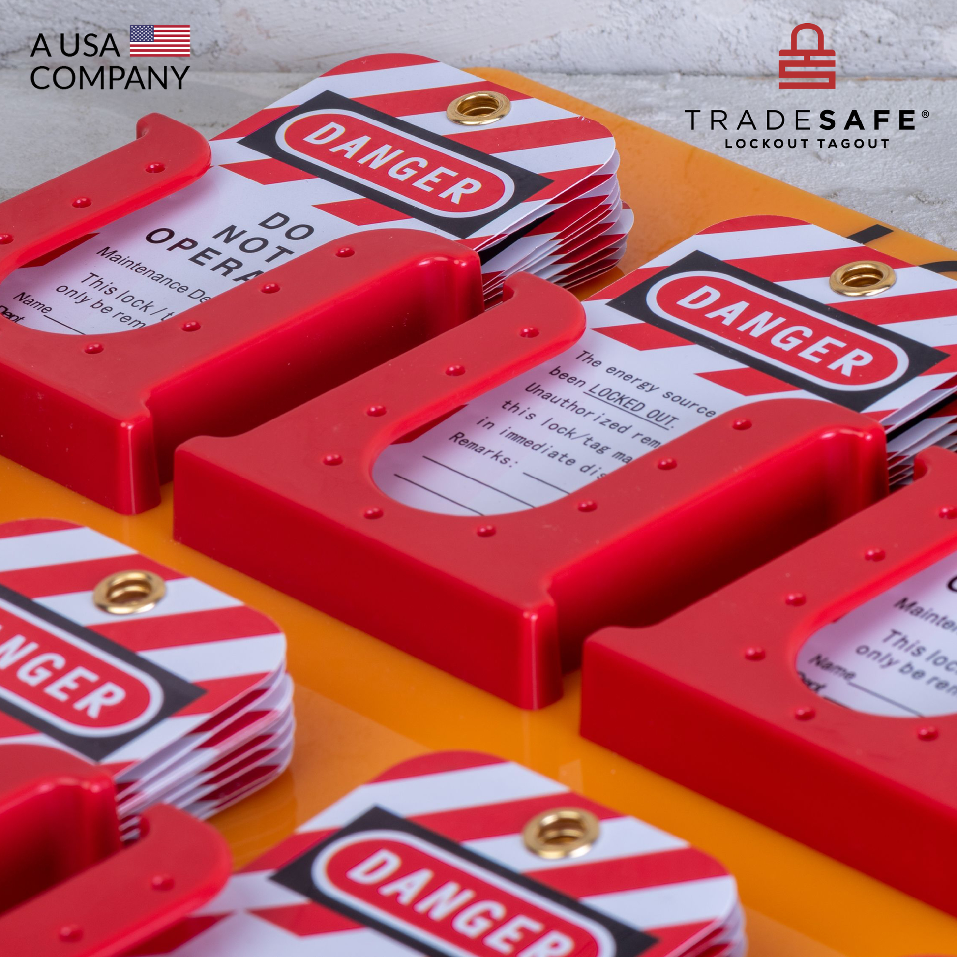 close-up view of an orange loto tags station ring down on a concrete floor