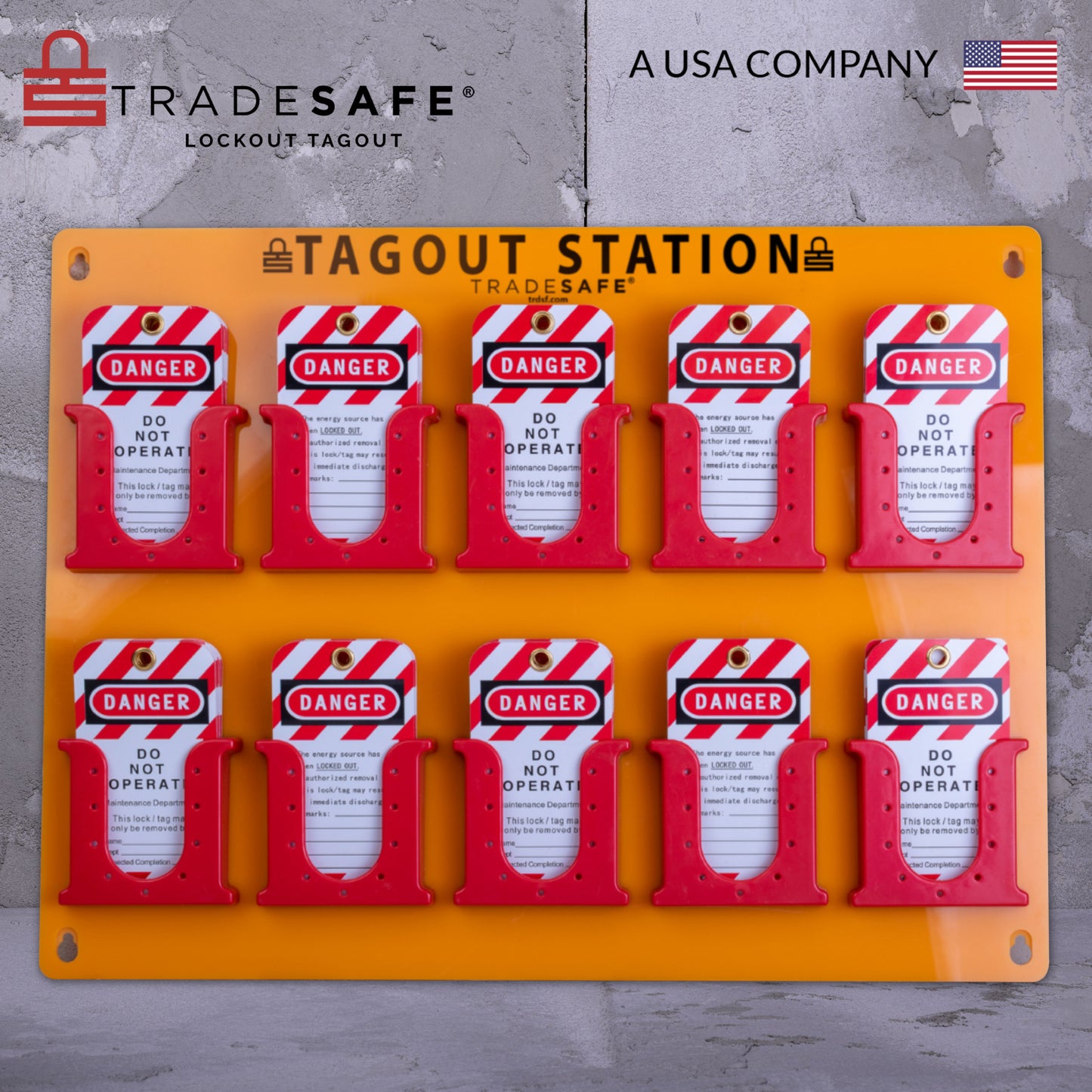 eye-level view of an orange tag station with 10 red tag boxes stocked with loto tags with a concrete background